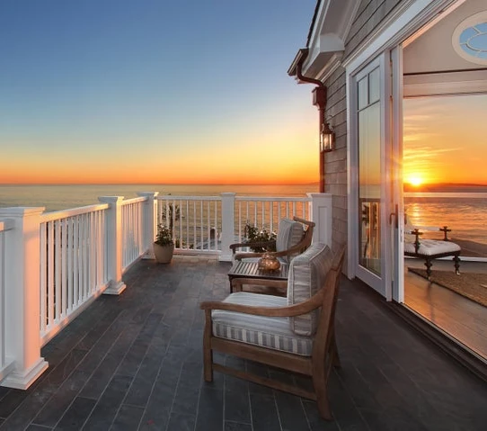 deck over ocean at sunset